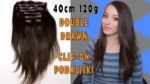 Ženska z dolgimi lasmi in clip-on podaljški 40cm 120g double drawn